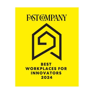 A yellow graphic with the text 'Fast Company' at the top. Below is an abstract black geometric design resembling a house with a spiral inside. Underneath, the text reads 'Best Workplaces for Innovators 2024'.
