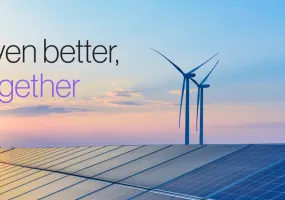 Image of a solar panel array with wind turbines in the background under a colorful sunset sky. The text 'Even better, together' is overlaid on the image.