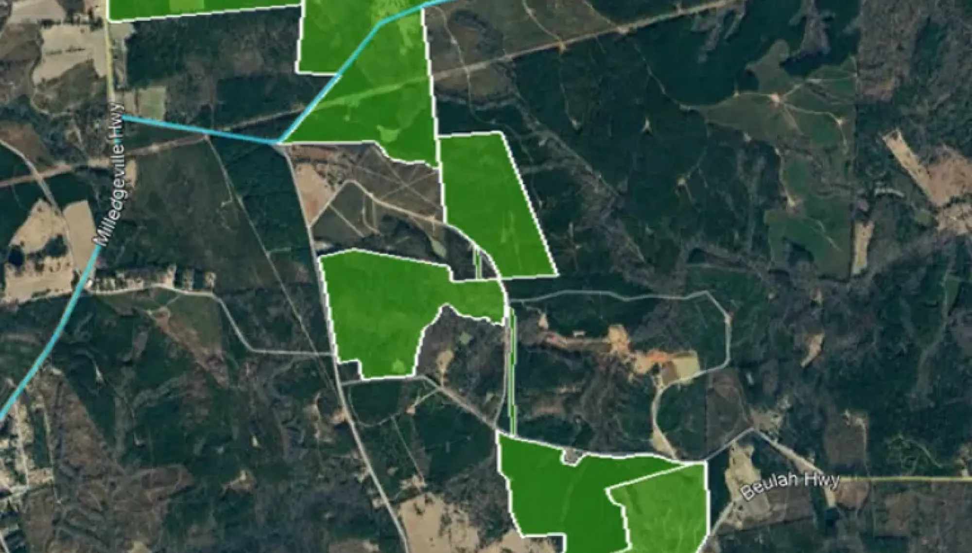 A satellite map showing a large area of land outlined in white and shaded in green. The land is divided into several irregular sections. Surrounding roads include Milledgeville Hwy, Pearson Chapel Rd, and Beulah Hwy. The background shows a mix of forested and cleared land.