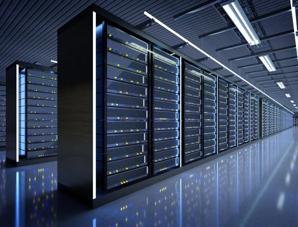 A modern data center with rows of illuminated server racks extending into the distance. The room is well-lit with overhead lights reflecting off the glossy floor, creating a futuristic ambiance.